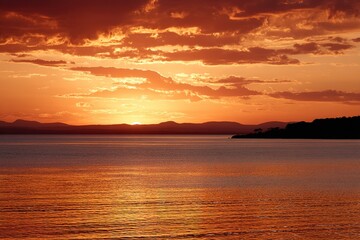 Obraz premium Sunset Over Calm Water