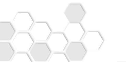 Abstract  white and grey hexagons with subtle shadows, clean, modern background featuring a repeating pattern creating a three dimensional effect. 