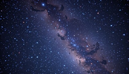 Obraz premium a vibrant cosmic scene dominated by a galaxy's nebula in hues of blues and purples, speckled with stars against the backdrop of deep space