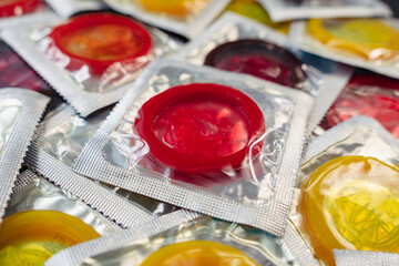 bunch of condoms on background. large number of condoms. The concept of safe sex. lots of rubber condoms.