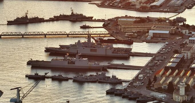 Aerial view of Toulon with ships and boats by the Marina Port with colourful houses at sunset. France