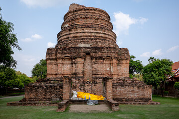 View of a chedi at Wat Yai Chai Mongkhon in the mid afternoon sun at Ayutthaya, Thailand.