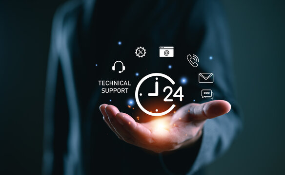 24-7 technical support concept. A businessman hand holds glowing icons of tools, chat, email, and phone, representing IT assistance, remote help, and digital customer care in modern business.