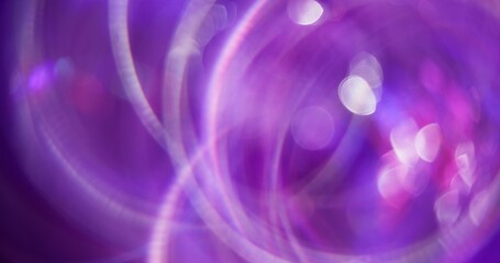 Blur neon texture. Bokeh effect. Gleaming multicolored purple pink optical glare lens flare abstract background.