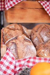Freshly baked bread rolls in a rustic display basket