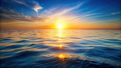 Obraz premium Serene ocean view with bright sun shining over calm water at sunrise