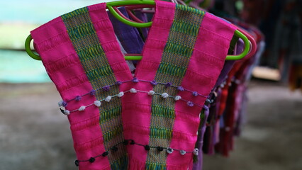 Colorful traditional Karen shirt displayed for sale at a local market of Karen hill tribe.
