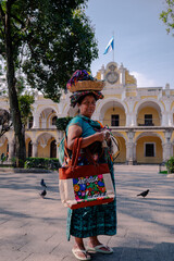 Traditional Mayan woman in colorful dress at Antigua Guatemala