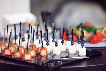 Fototapeta premium Gourmet Finger Foods on Skewers Arranged for an Elegant Event