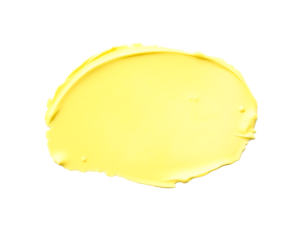 A smooth, textured swatch of yellow butter or cream on a transparent background.