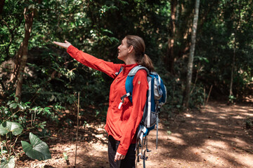 Hikers or explorers happy on journey carrying backpack, trekking poles looks observing and possibly guide trekking and trail exploration holiday ecotourism concept.