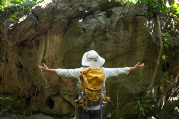Older trekking adventure carries backpacks poles enjoying nature expression looks into the distance observing and possibly guide trekking and trail ecotourism adventure concept.