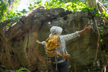 Older trekking adventure carries backpacks poles enjoying nature expression looks into the distance observing and possibly guide trekking and trail ecotourism adventure concept.