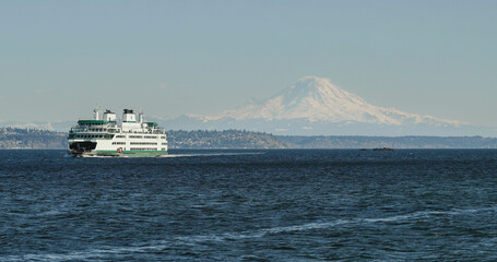 Seattle SDOT Ferry over Puget Sound to Bainbridge, Washington with Mount Rainier in the horizon.