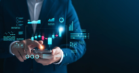 Businessman analyzing financial data and stock market trends on a smartphone with futuristic virtual interface, concept of financial technology, data analytics, and investment strategy.
