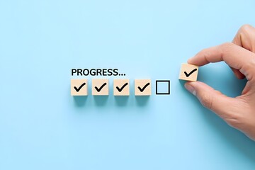 Checklist and task progress tracking concept. A hand placing the final checkmark on wooden blocks in a progress bar, task completion, productivity, goal setting, and efficient project management.