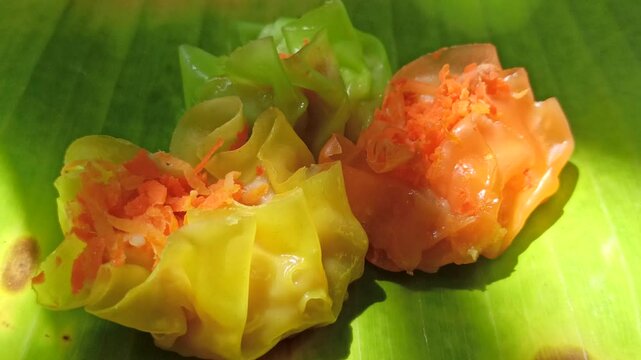 Colorful siomay filled with shrimp and vegetables, captured in soft blur and defocused background, highlighting delicious Indonesian street food.