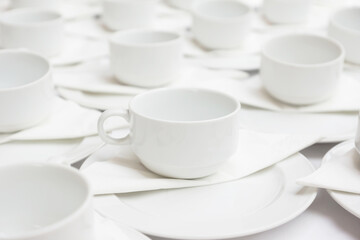 Elegant white cups and plates arranged for a warm, inviting moment, ideal for hotel dining, conference breaks, or restaurant settings that value comfort, hospitality, and refined simplicity.