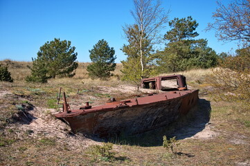 Metal wreck of a ship washed ashore
