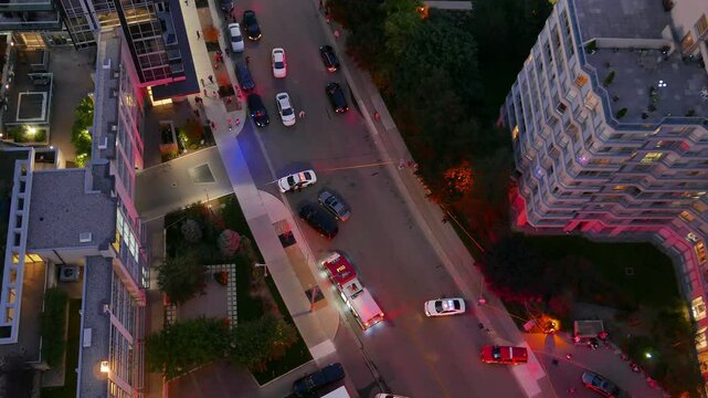Emergency response and at the scene of an incident in an urban residential area at night. As viewed from a high-rise in distress on September 12, 2016 in Mississauga, Canada. Handheld shot.