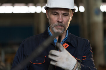 Worker, engineer, factory or storage warehouse. Senior engineer working in industry factory,...