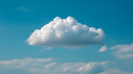 Fototapeta premium Single fluffy white cloud floating peacefully in a serene summer sky with soft natural lighting and clear blue backdrop, symbolizing calmness and simplicity in nature