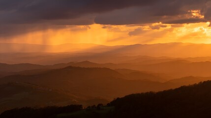 Fototapeta premium Panoramic sunset landscape with golden light streaming through dramatic clouds and blending into soft orange and purple hues under a tranquil evening sky