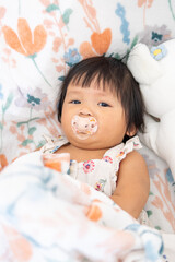One year old asian girl snuggling with teddy bear in cozy room adorable baby moments
