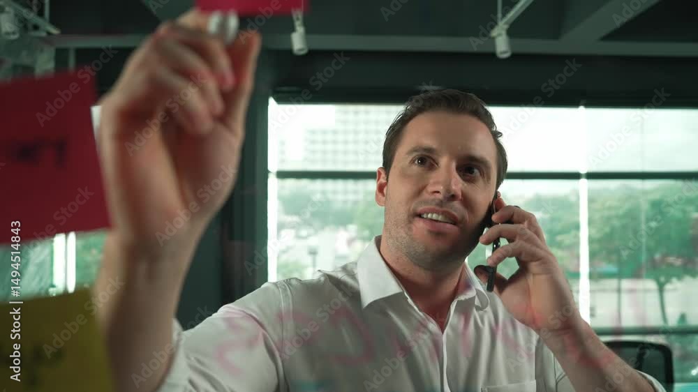 Poster professional businessman making phone call to customers while looking at marketing strategy idea wri