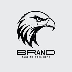Naklejka premium Eagle head logo design in black and white. Bold graphic design with a strong, aggressive profile view of an eagle's head, set against a neutral backdrop.
