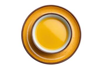 PNG Top view of yellow soup in ceramic bowl on plate