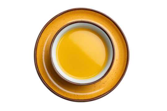 PNG Top view of yellow soup in ceramic bowl on plate