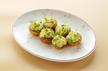 baked potato on a plate with greens