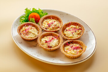 baked tartlets with cheese and herbs