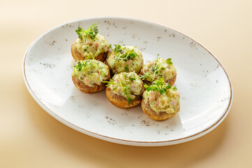 baked potato on a plate with greens
