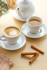 tea and coffee on the table with a kettle