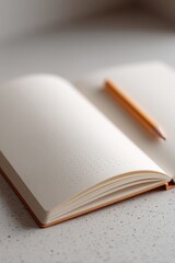 Fototapeta premium blank page lays open inviting creative thoughts accompanied by simple pencil against muted backdrop