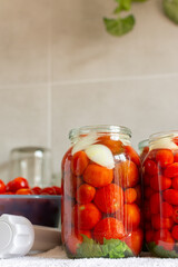 Homemade tomato preserves and tomato juice, canned and sealed for winter storage, maintaining flavor and freshness