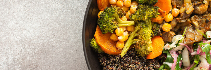 A vibrant, protein-packed breakfast with black quinoa, avocado, chicken, roasted veggies like sweet potato, broccoli, and a fresh salad of cabbage, radish, chia, and sesame seeds, banner