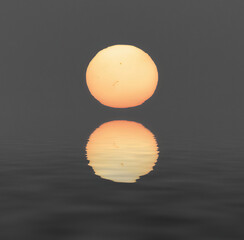 the sun is reflected in the water