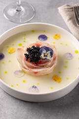 A traditional dish in Peru, ceviche, elegant appetizer of fresh fish in lime sauce leche de tigre, black caviar
