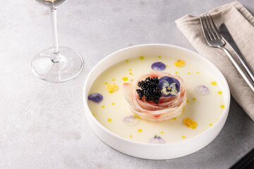 A traditional dish in Peru, ceviche, elegant appetizer of fresh fish in lime sauce leche de tigre, black caviar