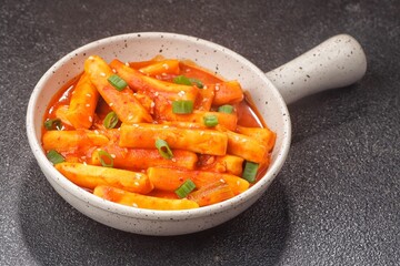 Tteokbokki is a Korean dish of rice flour cooked in spicy and sweet gochujang seasoning