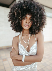 Afro Style Portrait of a Confident Fashionista Laughing with Glamour and Attitude. Smiling.