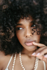 Afro Style Portrait of a Confident Fashionista Laughing with Glamour and Attitude. Smiling.