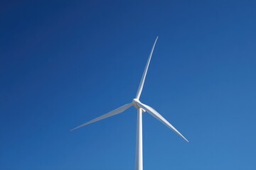 showcase solitary wind turbine against clear blue sky capturing its sleek and eco-friendly design in minimalistic style