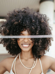 Afro Style Portrait of a Confident Fashionista Laughing with Glamour and Attitude. Smiling.