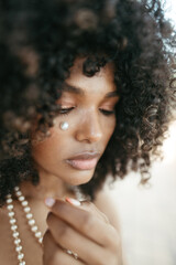 Afro Style Portrait of a Confident Fashionista Laughing with Glamour and Attitude. Smiling.