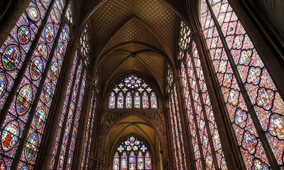 Ornate interior with stained glass windows and arches - Powered by Adobe