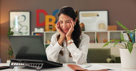 Education, laptop and stress with woman teacher at desk in office for burnout or headache. Anxiety,...
